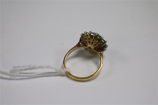 An 18ct gold, emerald and diamond cluster dress ring, size N.